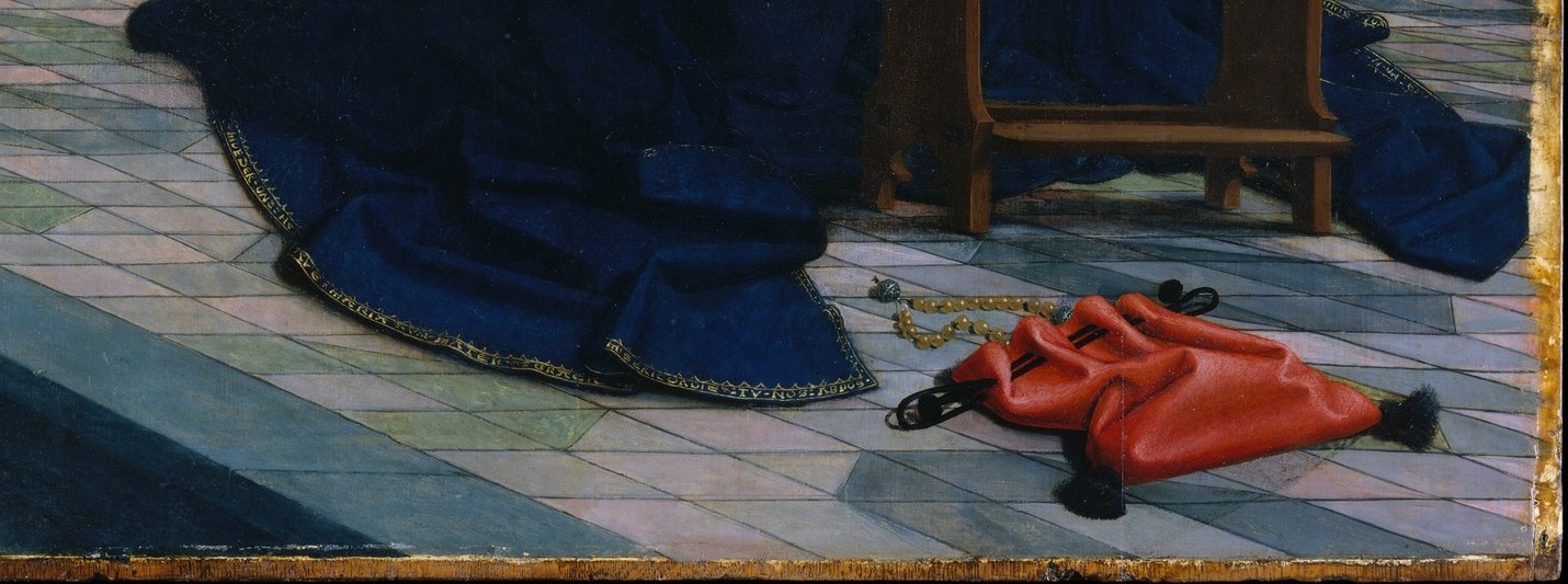 But look closely at the floor tiles, just above her hands.