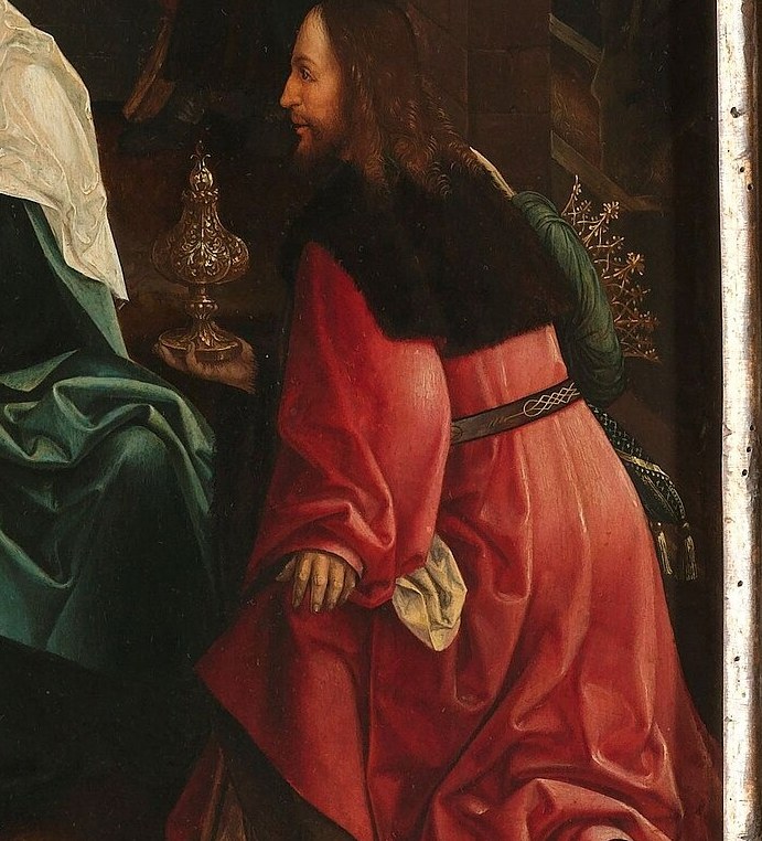 The kneeling Magus offers a precious gold cup.