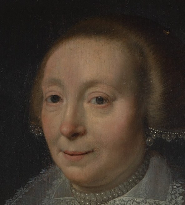 Her calm face shows the refined appearance of the time.