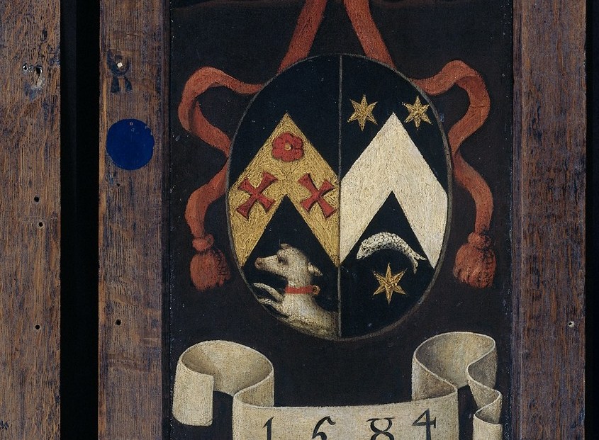 The second shield, mirroring the first, reinforces the theme of family unity and inheritance.