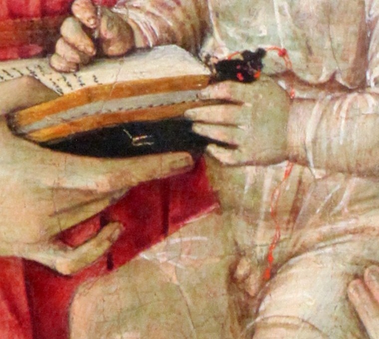Mary gently holds the Christ child, a scene of maternal love.