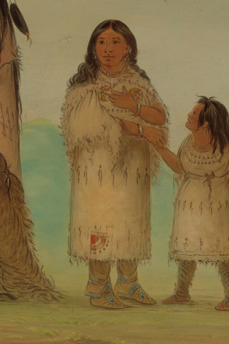 A woman holds a child, showing maternal care.