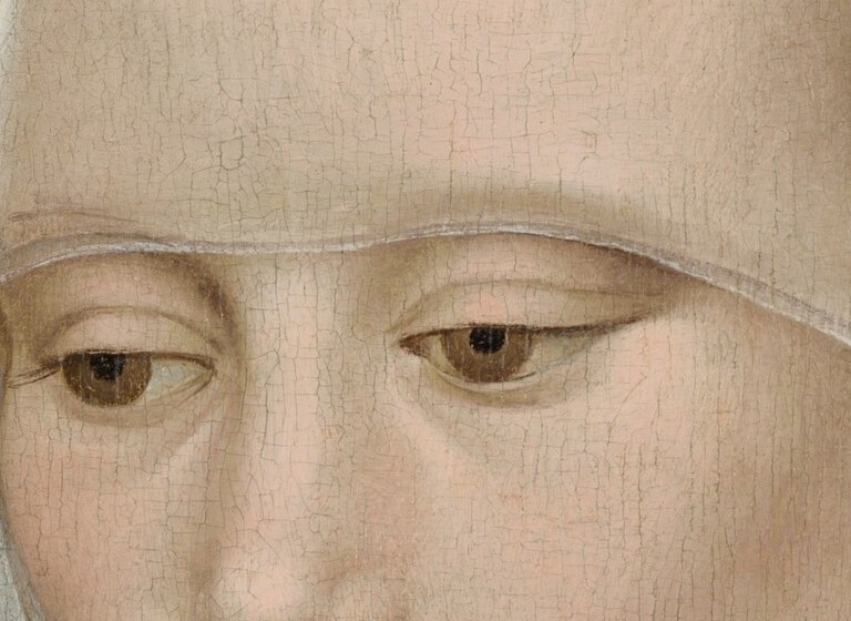 She offers a faint, Mona Lisa-like smile.