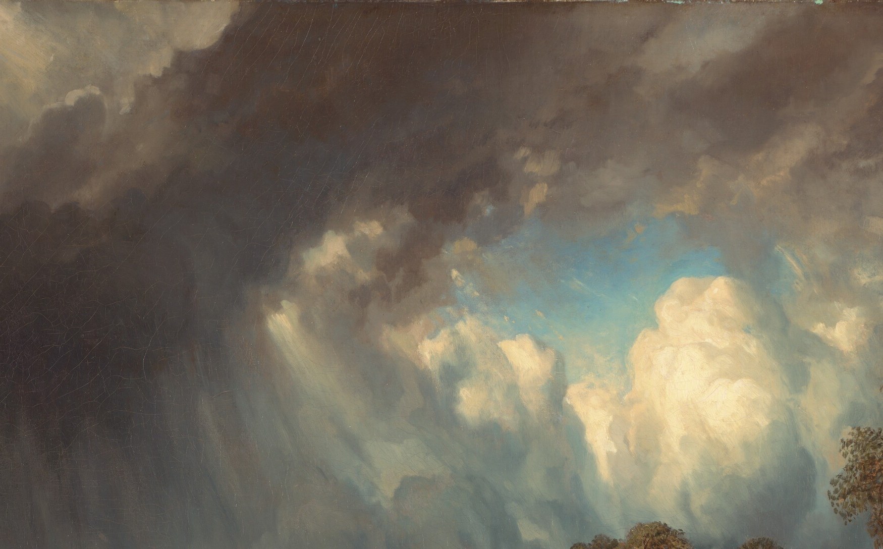 A warm break in the overcast illuminates the left sky; this contrast between lingering light and advancing shadow is the entire emotional argument of the composition.