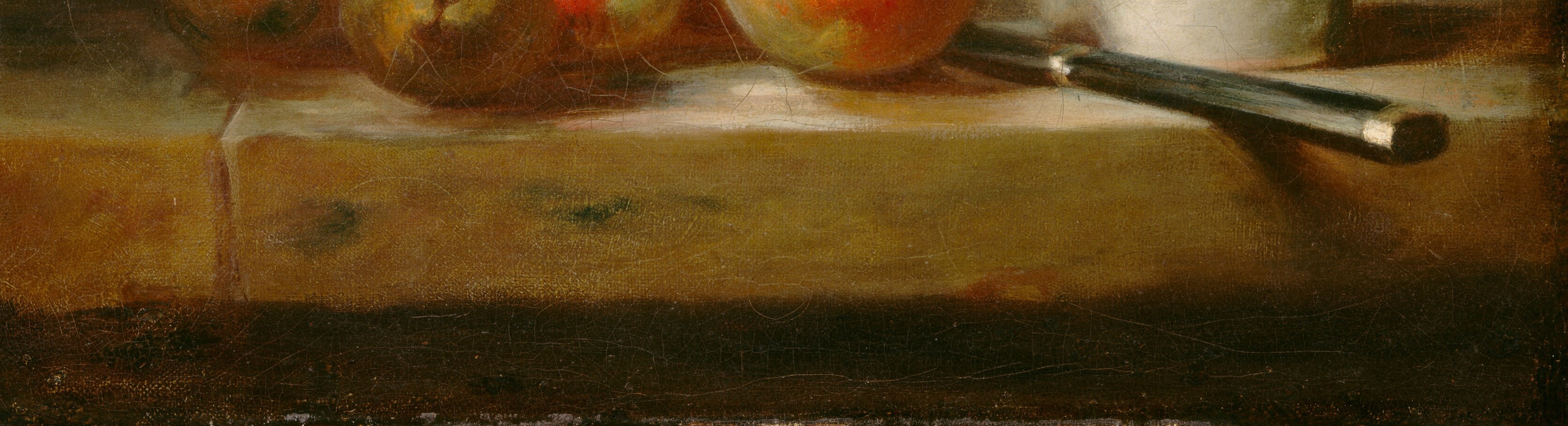 Notice the worn grain of the wooden table beneath.