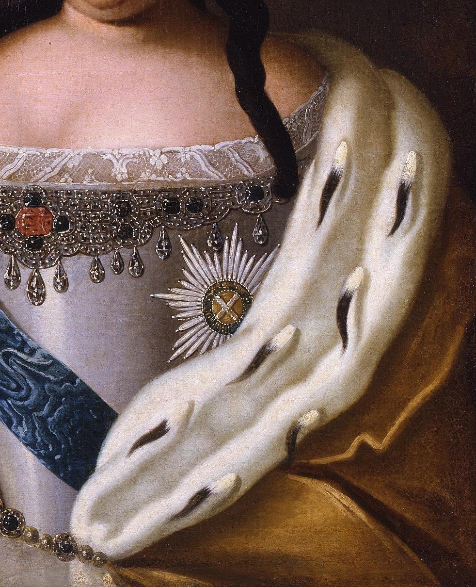 Her fur mantle emphasizes great wealth.