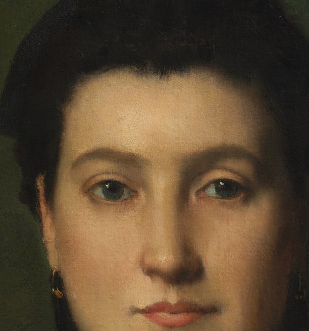 Her steady gaze holds quiet strength.