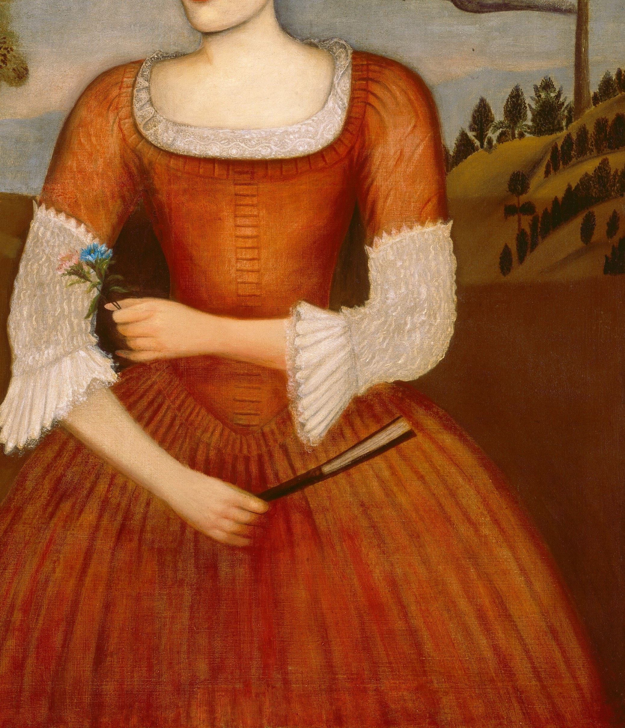 She wears an elaborate dress, a sign of her status.