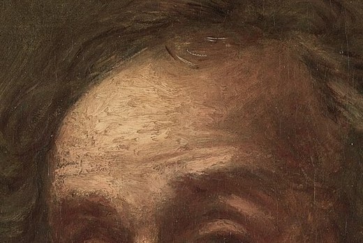 Every furrow in his forehead tells a story of deep thought.
