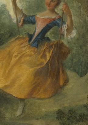 Her yellow gown billows with playful abandon.