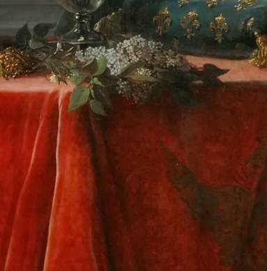 A clear symbol of royalty, its placement suggests the weight of her position.