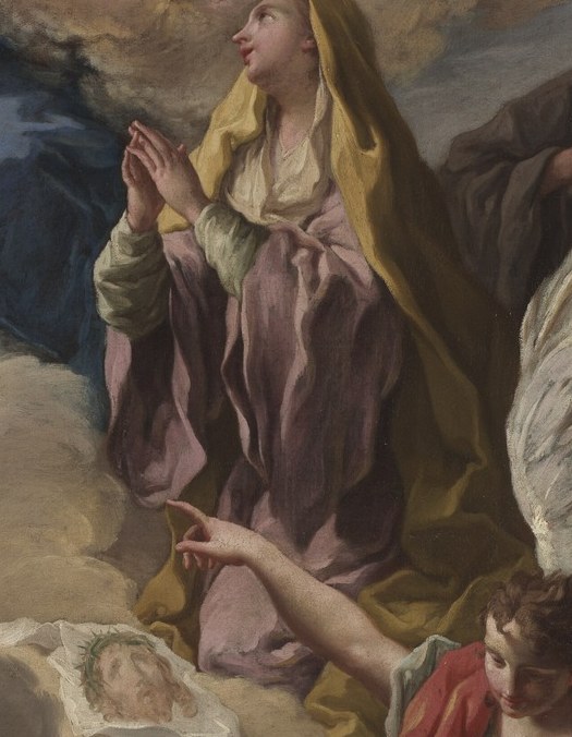 A devout woman kneels before them.