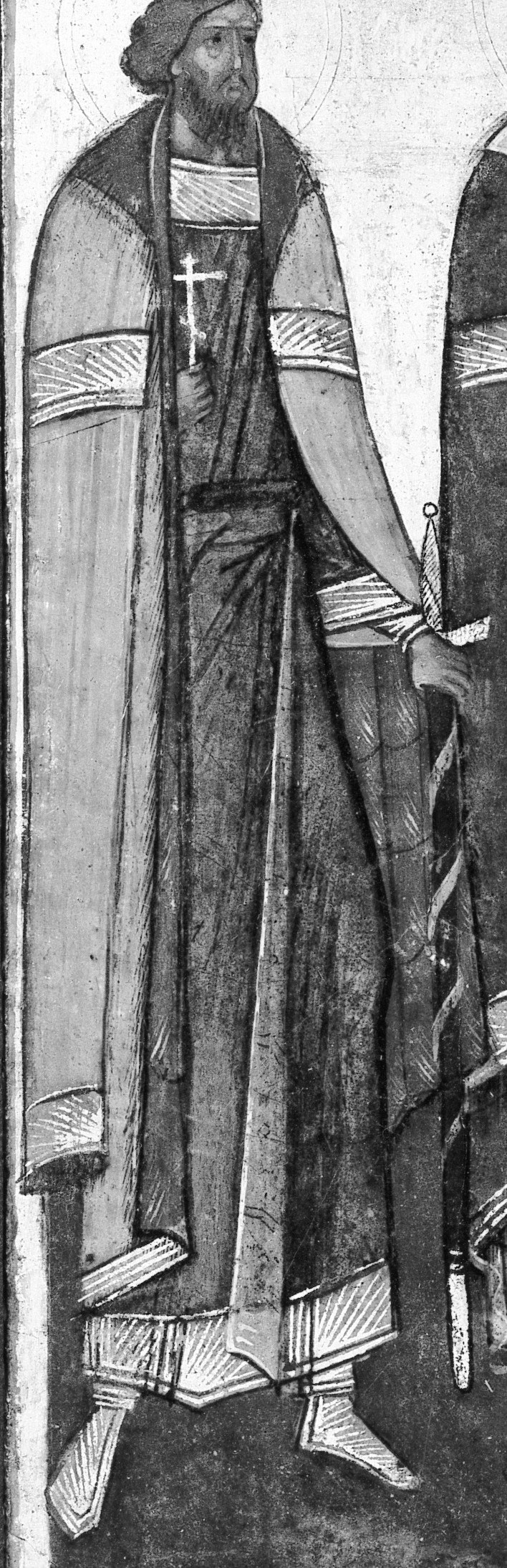 The cross on this figure's hat indicates a saint or bishop.