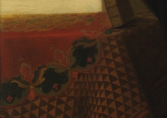 But the ornate chair and red velvet signal his wealth.