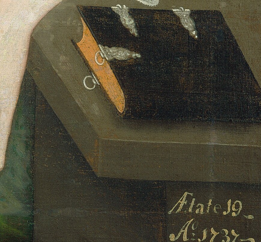 On the table, a book and key suggest her domestic role.