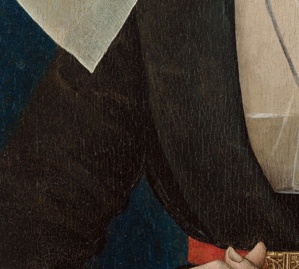 Her left hand rests gently, not stiffly formal.