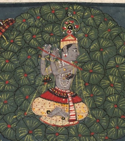 Here is Krishna, playing his divine flute.