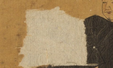 He holds a white cloth, a subtle hint of refinement.