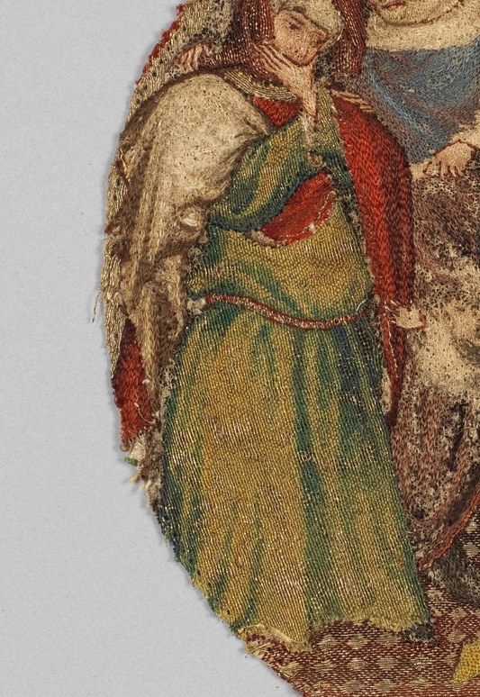 His mother’s hands, however, are clasped, perhaps in worry or shock.