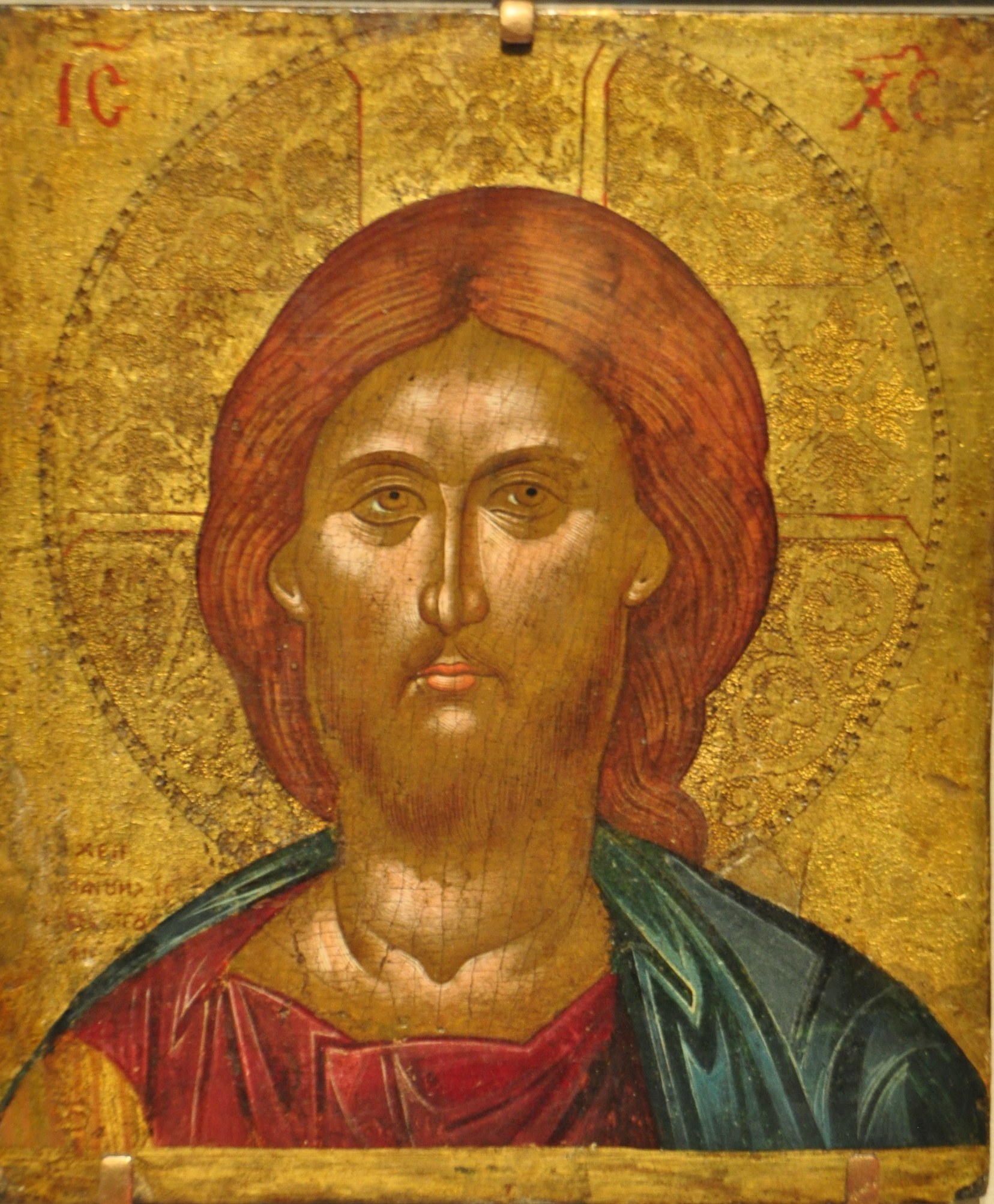 The shimmering gold evokes the divine and heavenly realm, typical of icons.