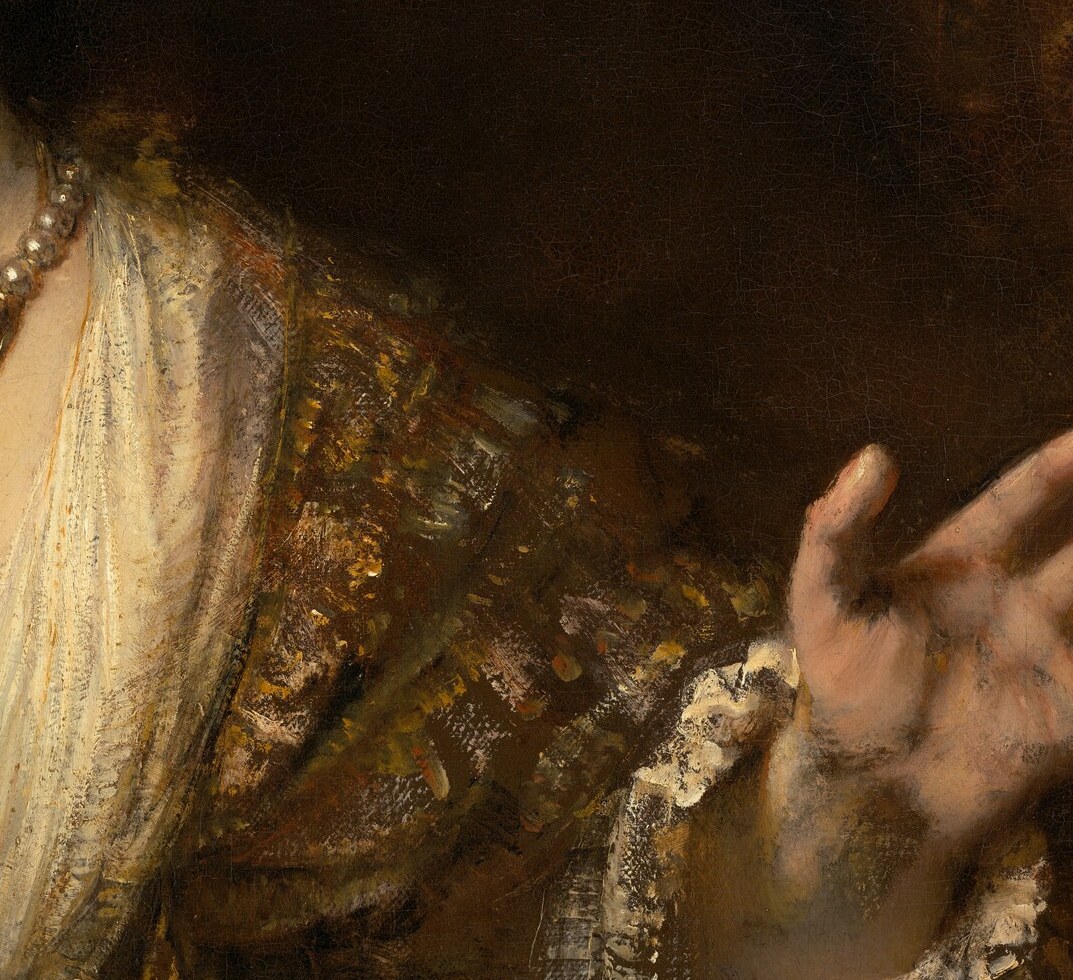 Her left hand opens in farewell.
