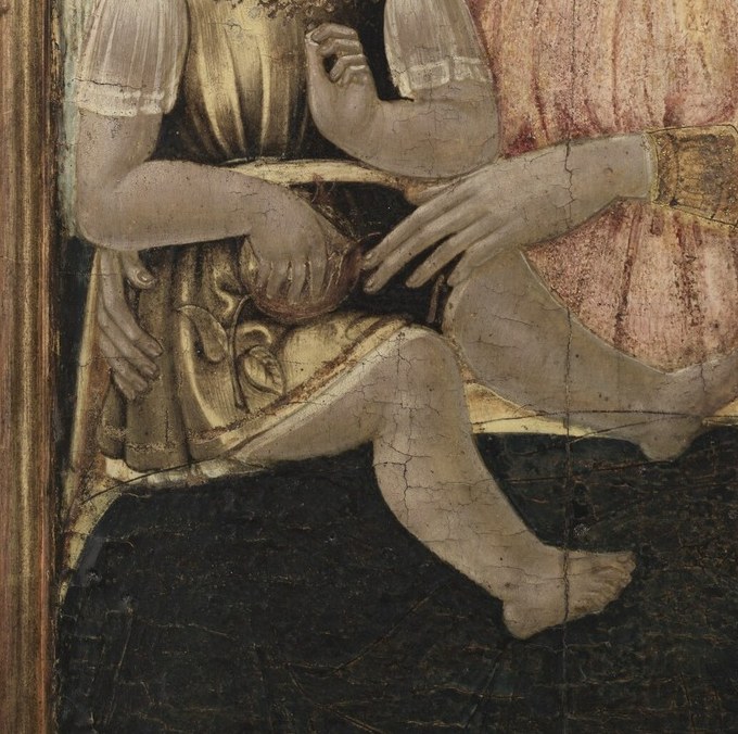 The Virgin Mary cradles her child, a tender, protective hold.