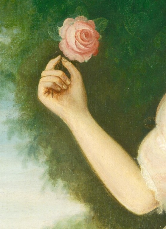 And she holds a pink rose, a symbol of feminine virtue.