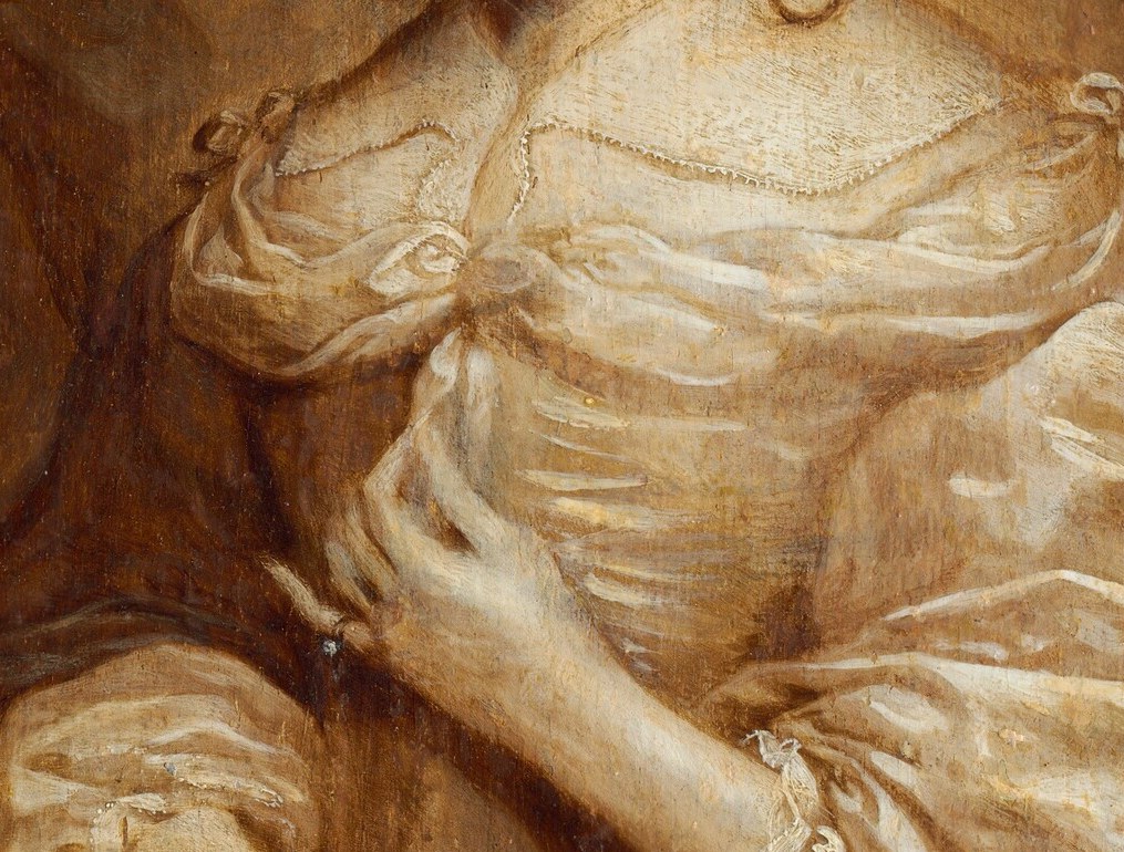 No needle. No spindle. Only hands at rest, belonging to a thinker.