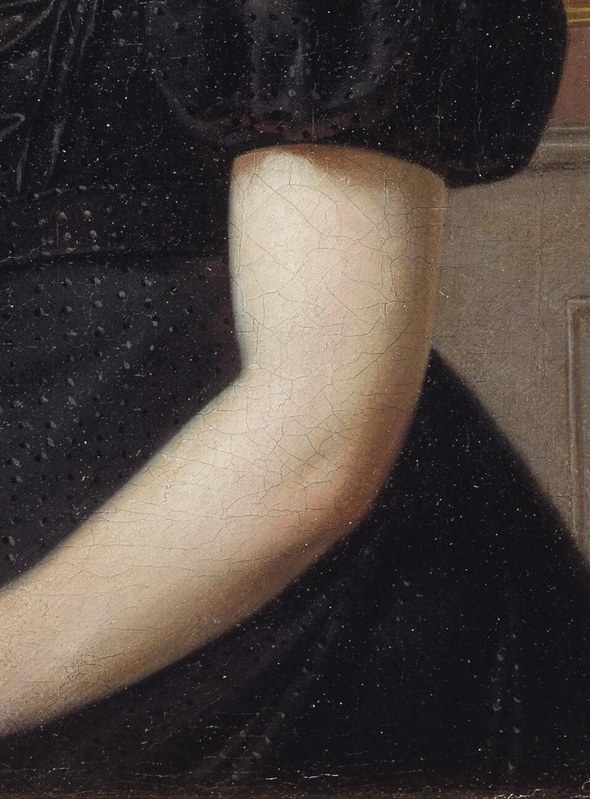 Look closely at the dark, elegant chair where she sits.