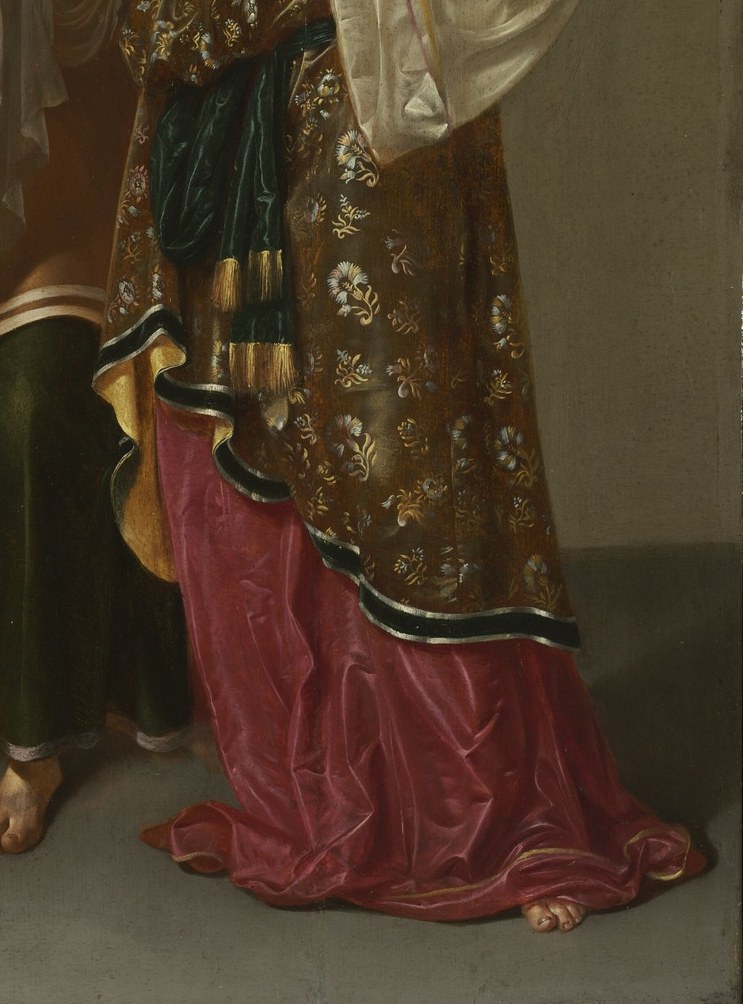 Notice her richly patterned dress, reflecting her status.
