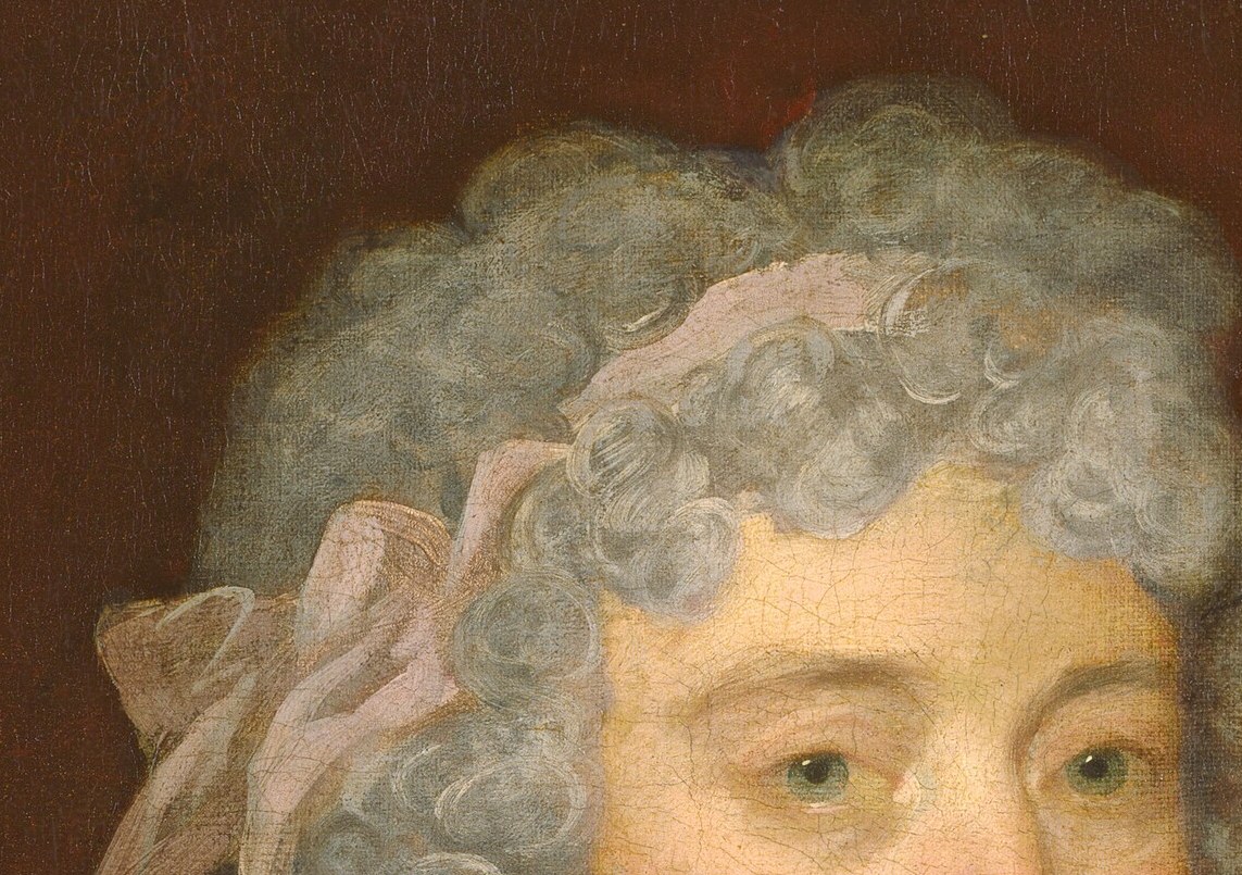 Those vivid cheeks are almost pure paint. Deliberate, applied rouge.