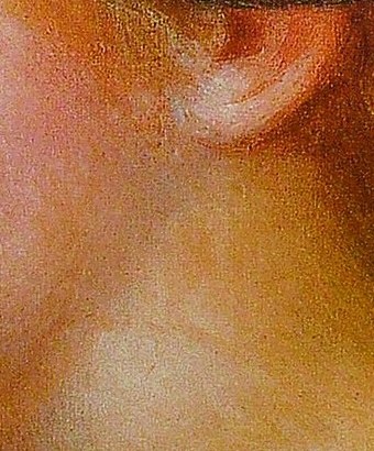 He captures the soft blush on her youthful cheek.
