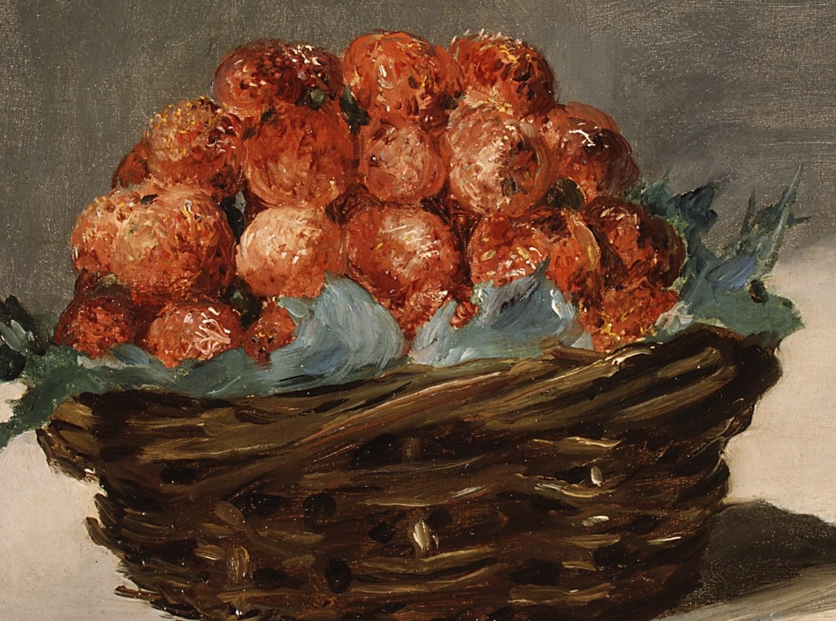 The vibrant red of the strawberries contrasts with the dark, textured basket, creating a focal point of abundance and natural beauty.