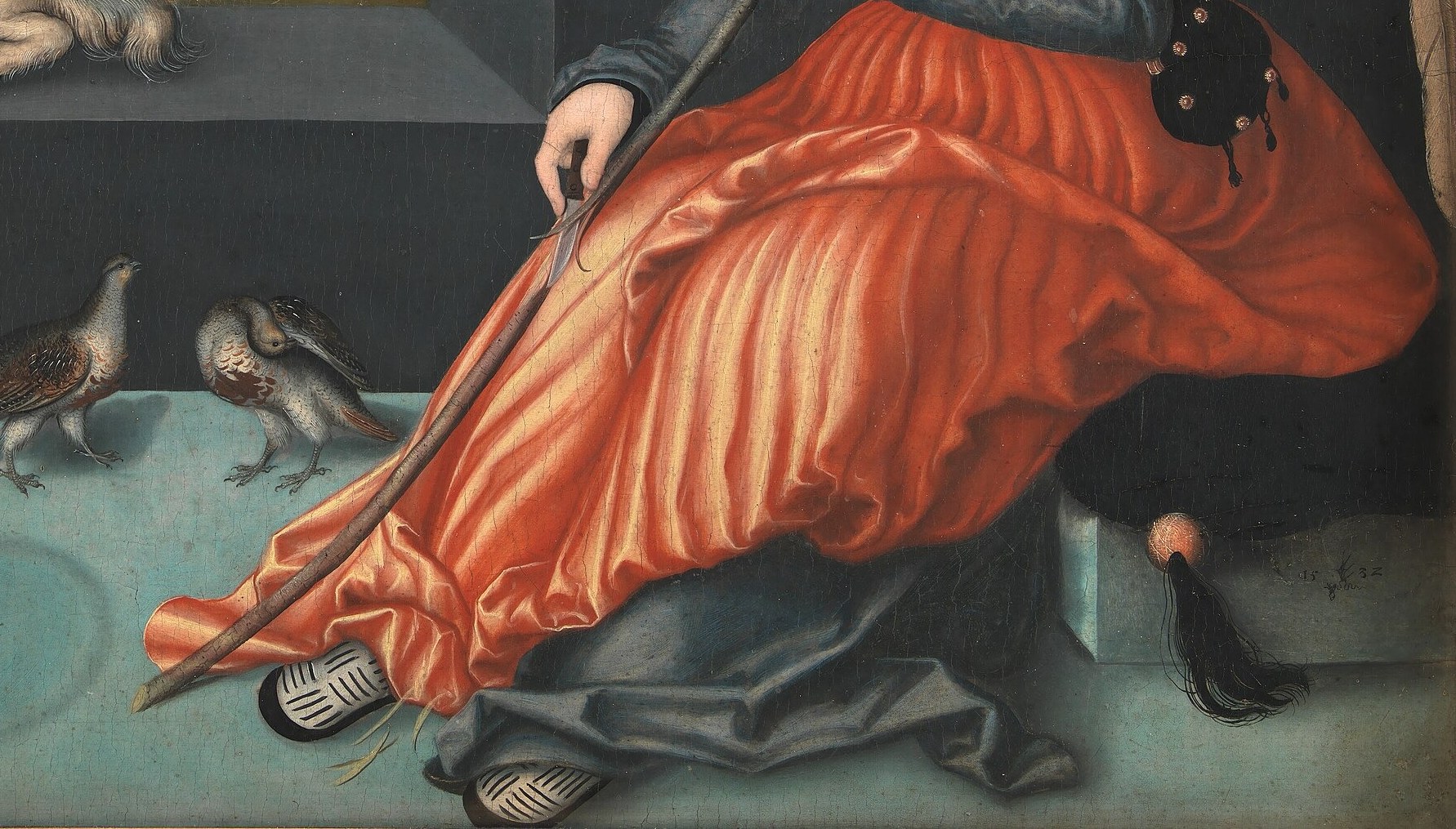 Look closely at the angel's red dress.