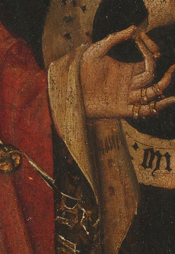 Her scroll, also parchment, holds indecipherable script.