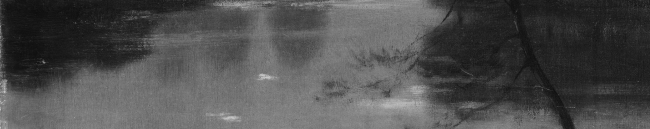 The calm water reflects the fading light and distant trees.
