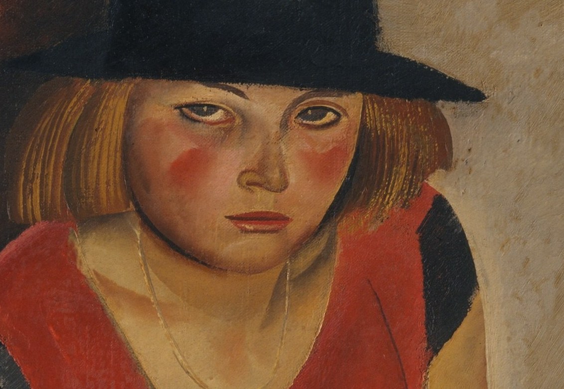 The wide brim casts a shadow, adding a sense of mystery and framing her face.