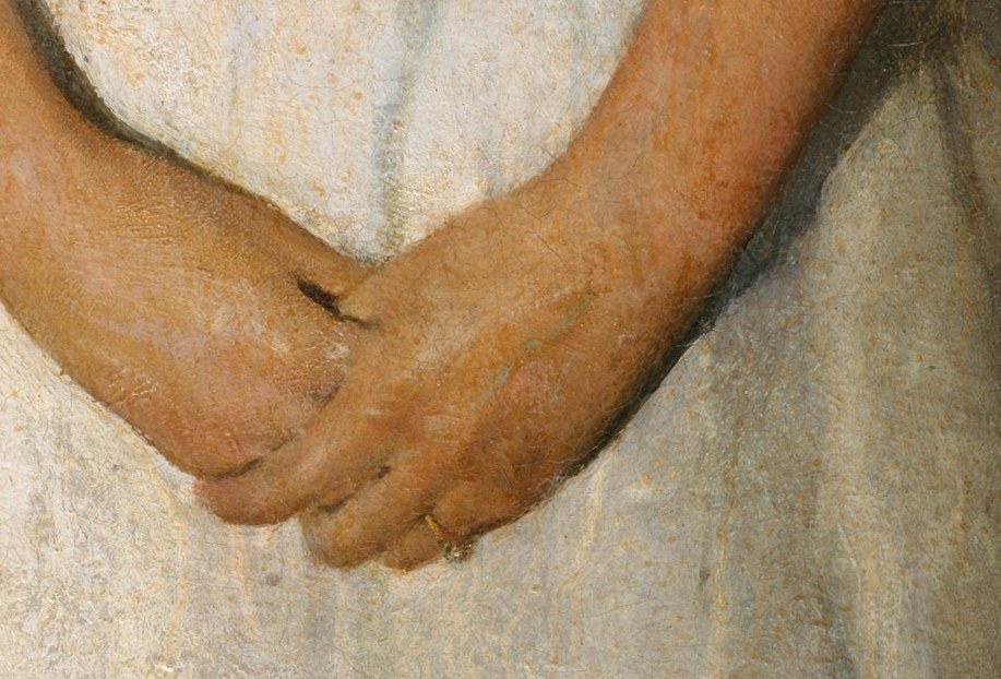 Her folded hands convey quiet resignation.