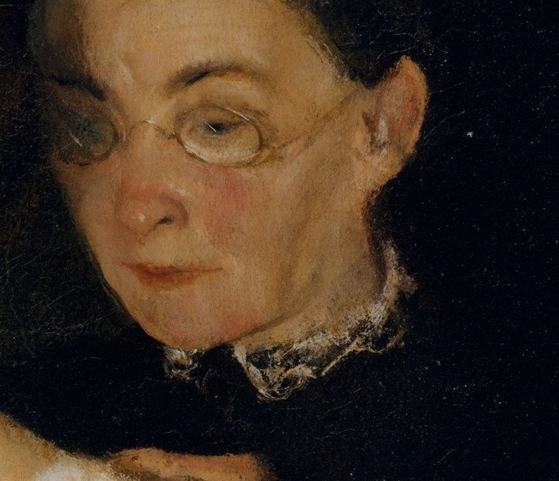 An older woman oversees her work.