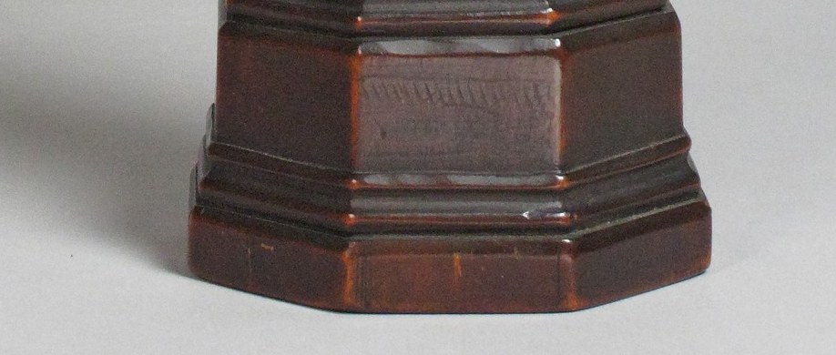 The geometric precision of the octagonal base contrasts with the organic figure above; its facets would have been gilded or painted for liturgical use , check for traces of color at the edges