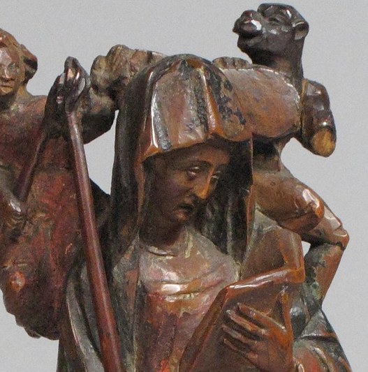 The serene carved expression is the devotional core of the piece , a medieval sculptor's translation of divine calm into wood, worth dwelling on for how much feeling survives 575 years