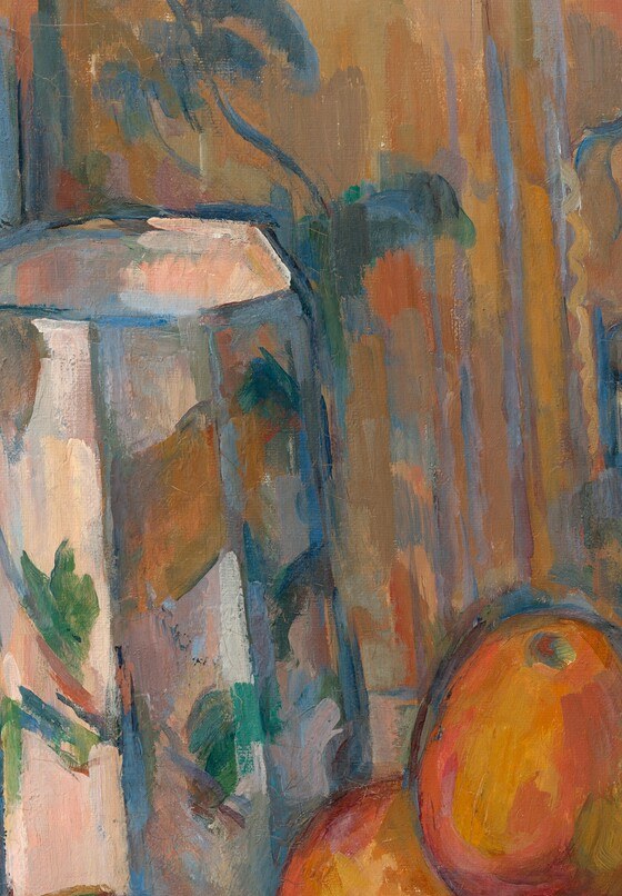 The tallest vertical element and compositional anchor; its floral blue-and-white decoration contrasts with the muted surroundings and draws the eye immediately