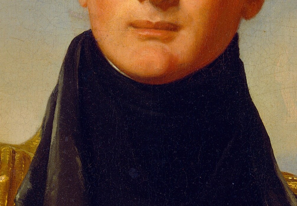 Gold on each shoulder. The white of the cravat pulls the eye up.