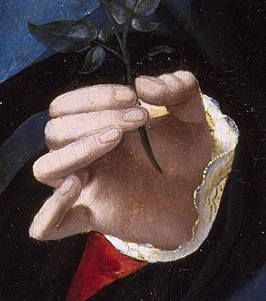 But look closely at what she holds in her hand.