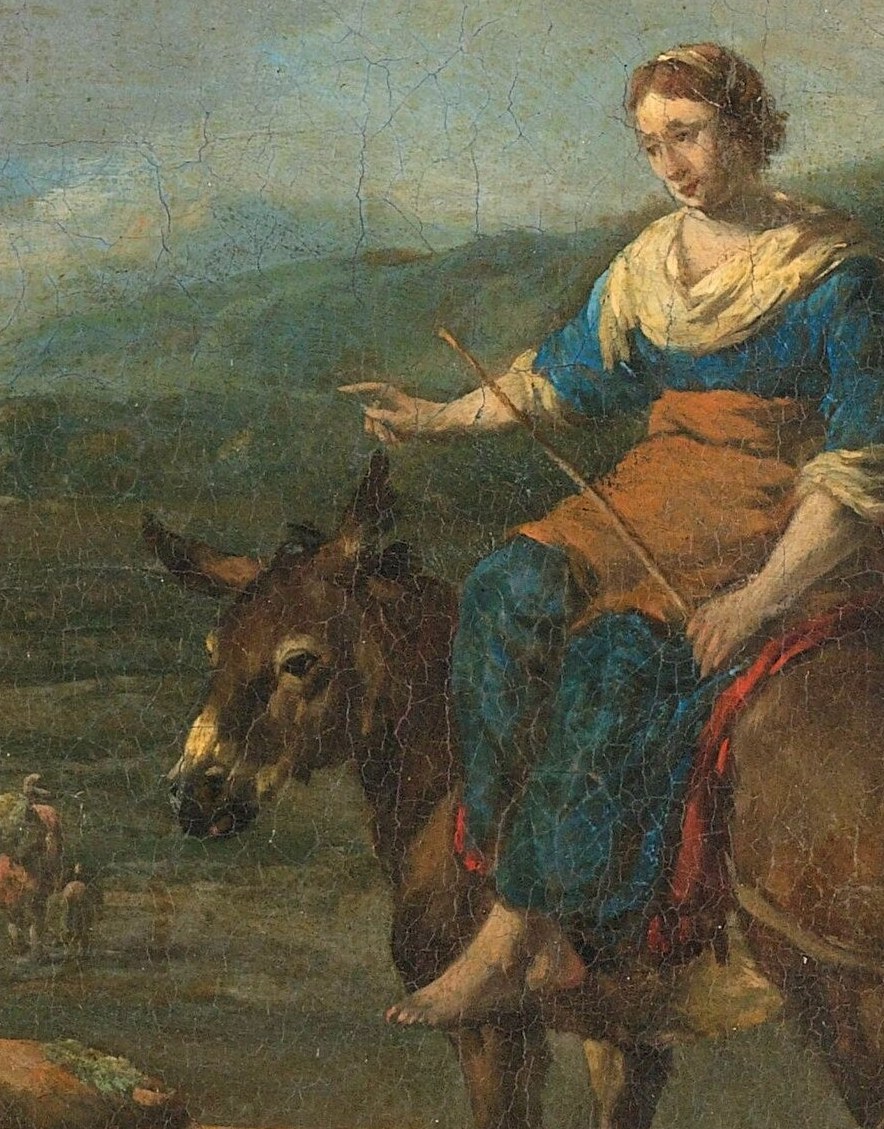 A woman rests on her donkey, carrying her bundle.