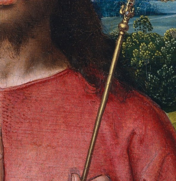 A frontal Christ, blessing hand raised, orb in his grip.