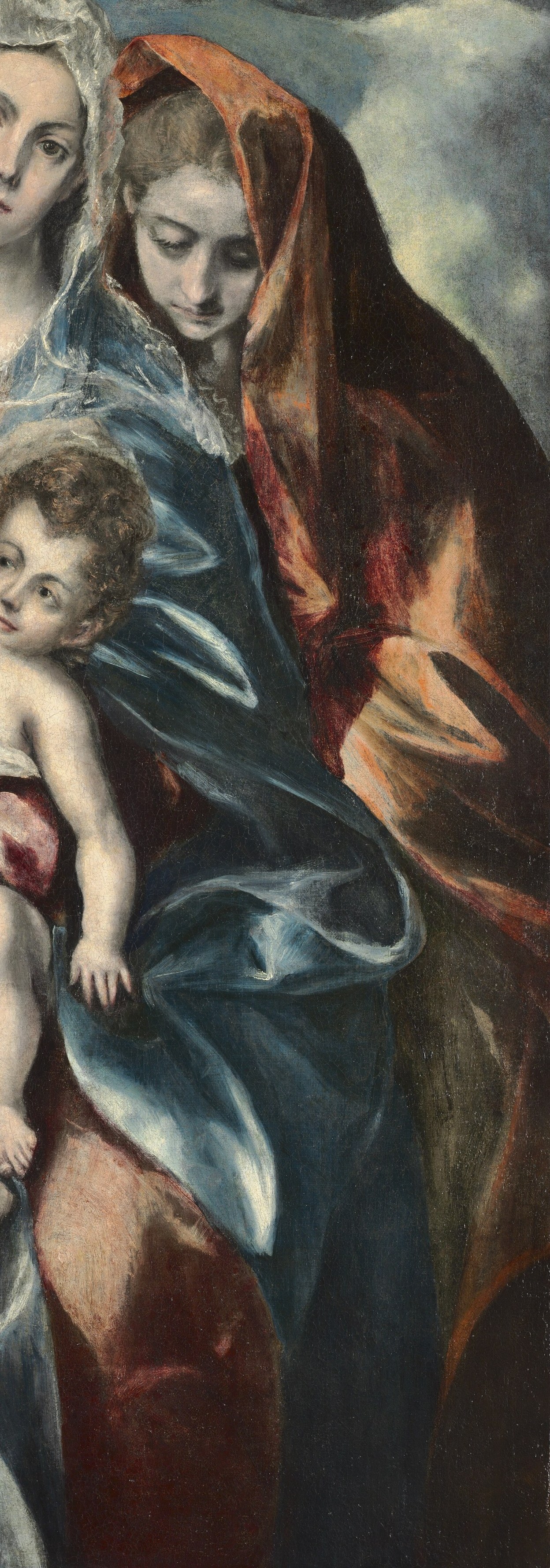 The rich, voluminous fabric creates a dramatic silhouette, emphasizing her presence.