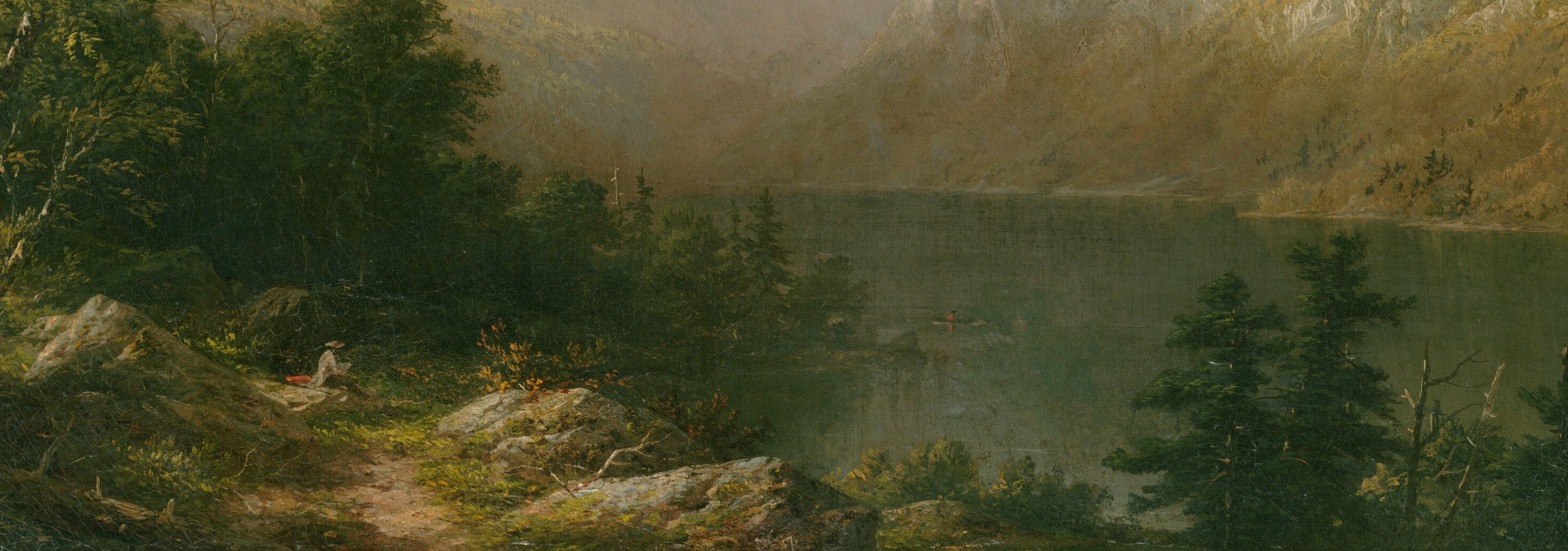 The still water perfectly reflects the sky and distant mountains.