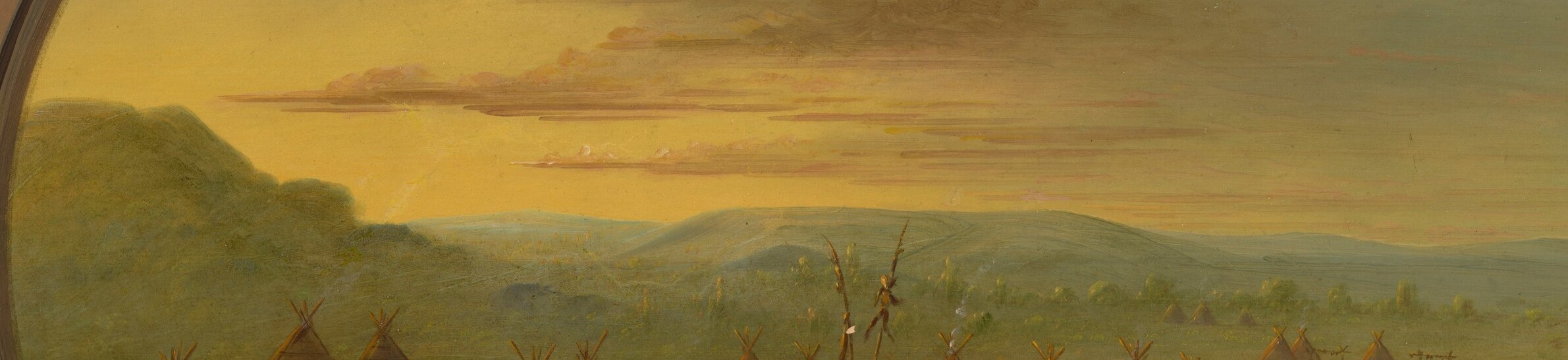 The hazy, layered mountains provide a sense of depth and the vastness of the landscape.