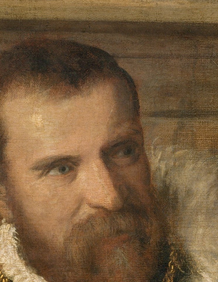 His gaze is direct, a look of intelligence and quiet authority.